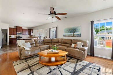 Living room featuring light wood-style floors and