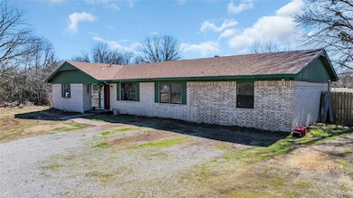 Ranch-style home with brick siding and a shingled roof