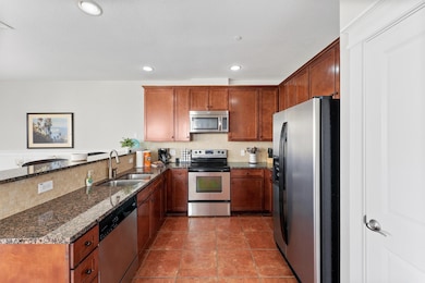Whip up your favorite meals in a fully equipped kitchen featuring stainless steel appliances, double basin sink, and thoughtful layout with efficiency in mind.