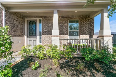 Super cute front porch with plenty of room for rocking chairs. Relax and watch the kids play out front.