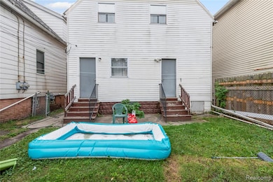 Rear view of property with entry steps