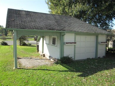 Charming garage!  Carport is a drive thru, you'll 