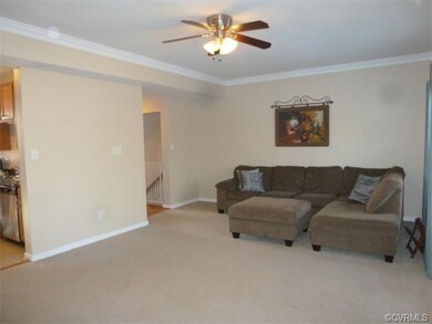 Family Room with Crown Molding and Ceiling Fan...v