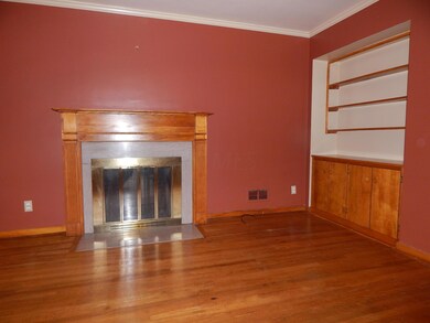 Living Room with Fireplace and Bookcase