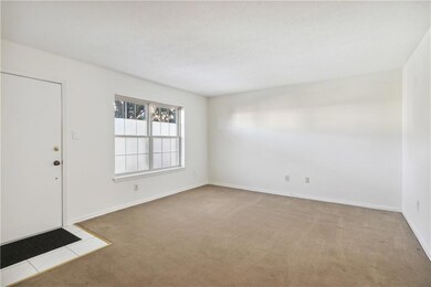 Living Room. Double windows afford view of lovely 
