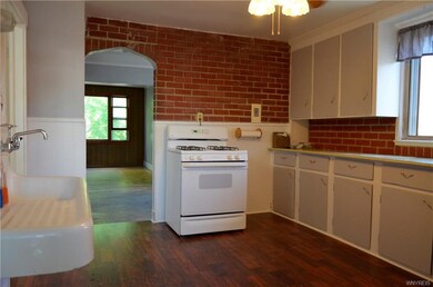 Remodeled kitchen in the upper with new wood floor