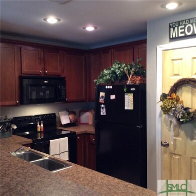 Kitchen includes smooth cooktop, built in microwav