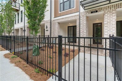 A gated front entry with fenced front yard equipped with irrigation and maintained by the HOA.