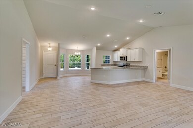 Kitchen with baseboards, stainless steel appliance