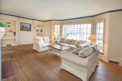 Extra large living room has fireplace, hardwood fl