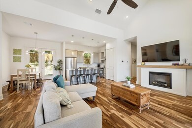 Living area featuring ceiling fan, wood finished 