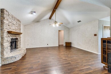 Unfurnished living room with vaulted ceiling with 