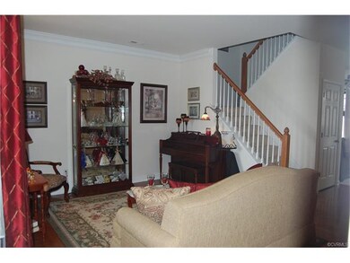 FORMAL LIVING ROOM WITH HARDWOOD FLOORS