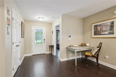 The entryway features a wide closet for storing co