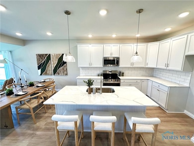 Kitchen with Quartz Countertops & Island Seating