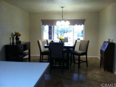 FORMAL DINNING AREA OFF KITCHEB