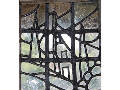 Leaded glass in the design of the house in the woo