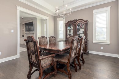 Dining space with a notable chandelier, a healthy 
