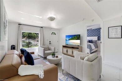 Living room with baseboards and light marble finis