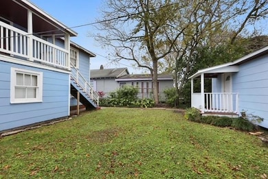 Back yard and cottage in rear