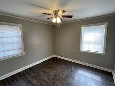 Unfurnished room with a ceiling fan, crown molding