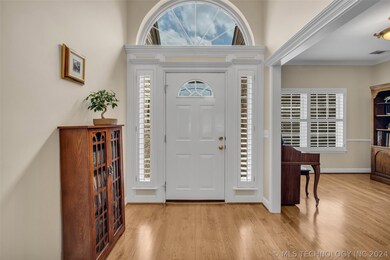 Enter to high ceiling foyer with lots of natural l