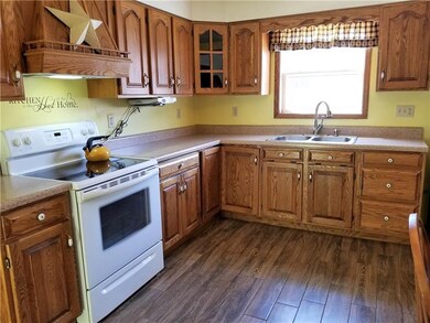 Kitchen with sold oak cabinets.