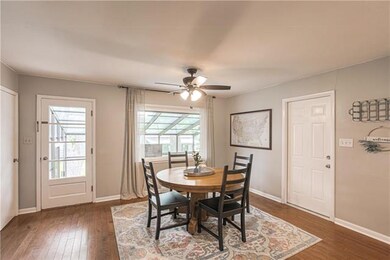 Light and bright dining area. The door to the righ