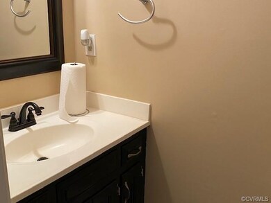 Half bath in mud room next to laundry room