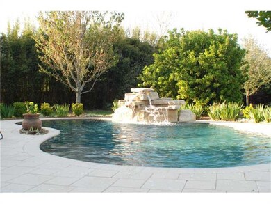 Photo. Lavishly landscapred rear yard with ingroun