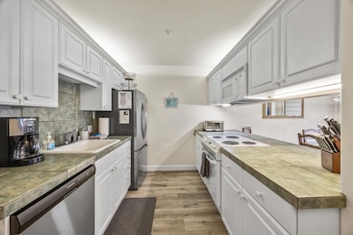 Light and bright kitchen with breakfast bar.