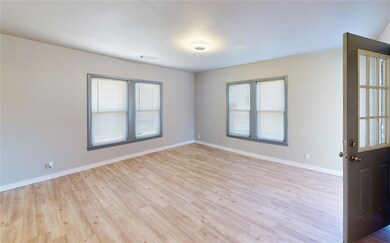 Spare room featuring light hardwood / wood-style f