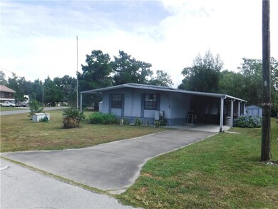 side and back exterior with carport and back porch