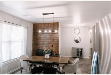 Dining space with visible vents, a notable chandel