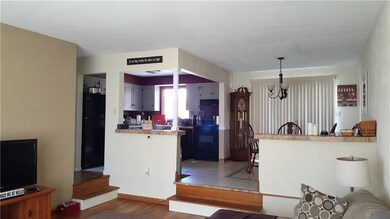 Open floor plan of kitchen, living room and dining