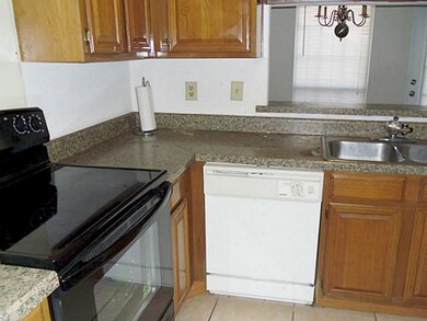 Kitchen window opens to  dining area.