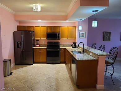 Kitchen with breakfast bar, granite countertops an