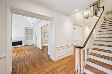 As you enter through the front door, you are warmly greeted by gleaming hardwoods and high ceilings.