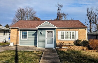 View of front of property with a front yard