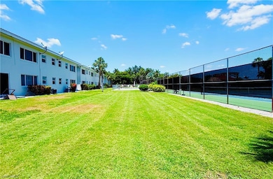 View of yard with fence and central AC unit