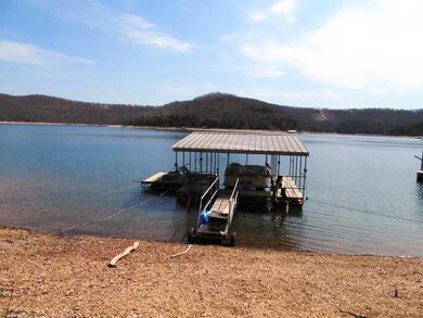 Waterfront/Dock/Pier. Private Permit and one stall dock w/ swim deck to convey.