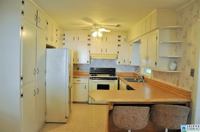 Full view of kitchen from eat in area