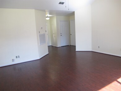 view from den to  front foyer and to garage