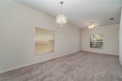 Living/dining room featuring carpet floors and cei