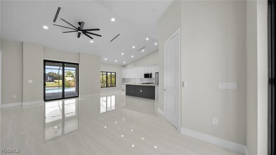 Unfurnished living room featuring recessed lighting, a ceiling fan, high vaulted ceiling, and light wood-style floors