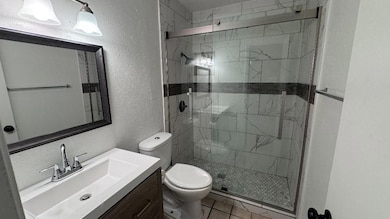 Bathroom featuring vanity, tile patterned floors, 