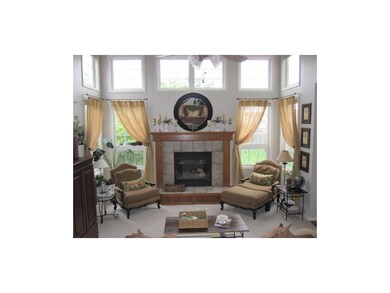 Great room with beautiful windows & tall ceiling