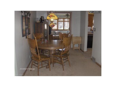 Centrally located dining room off kitchen family room and living room.