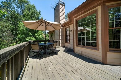 Wooden deck featuring outdoor dining area