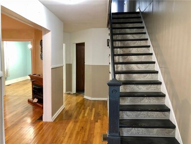 MAIN LEVEL ENTRY HALL WITH VIEW OF LIVING ROOM, DI